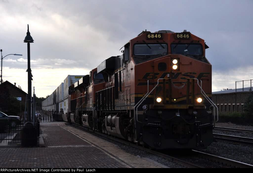 Intermodal cruises west past the station